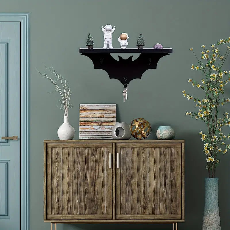 Black wooden bat shaped floating wall shelf featuring three metal key hooks for hanging gothic decor — view 5