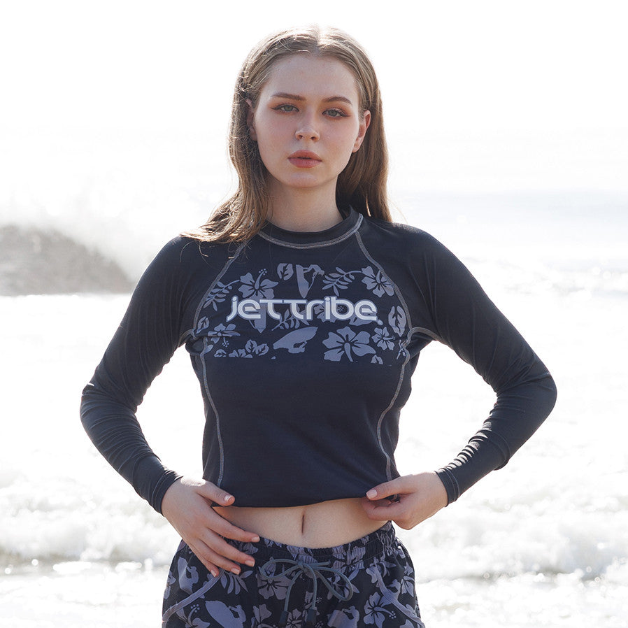 Women's black floral rashguard for water sports, featuring fade-resistant graphics and UV protection fabric