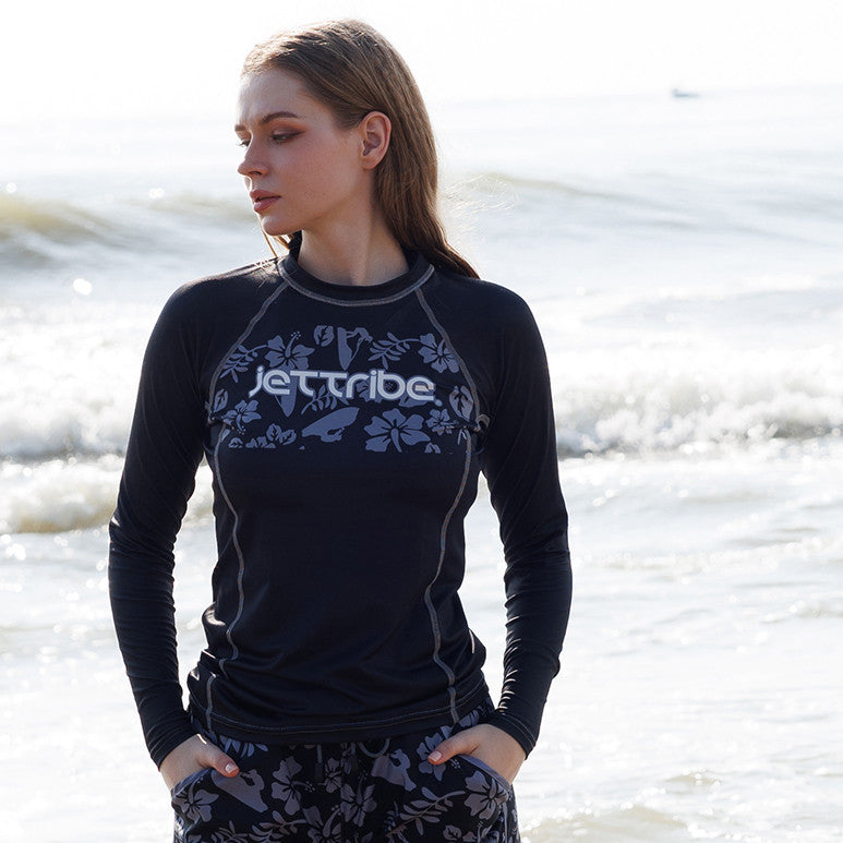 Women's black floral rashguard for water sports, featuring fade-resistant graphics and UV protection fabric — view 3