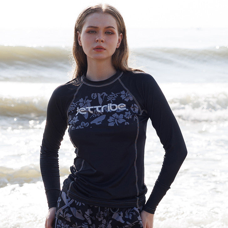 Women's black floral rashguard for water sports, featuring fade-resistant graphics and UV protection fabric — view 4