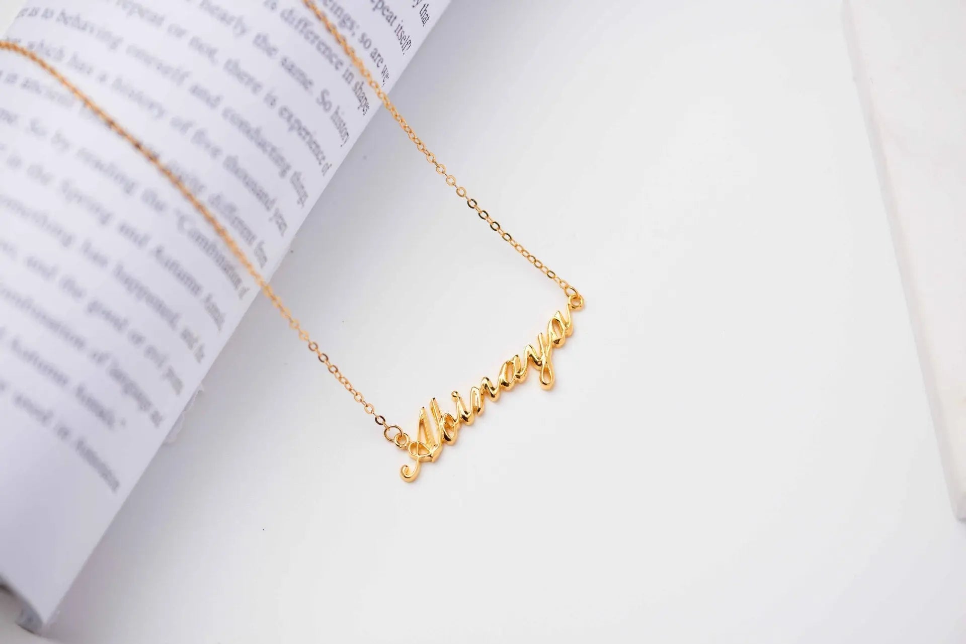 Personalized 925 sterling silver name necklace featuring an elegant script font and an adjustable delicate chain
