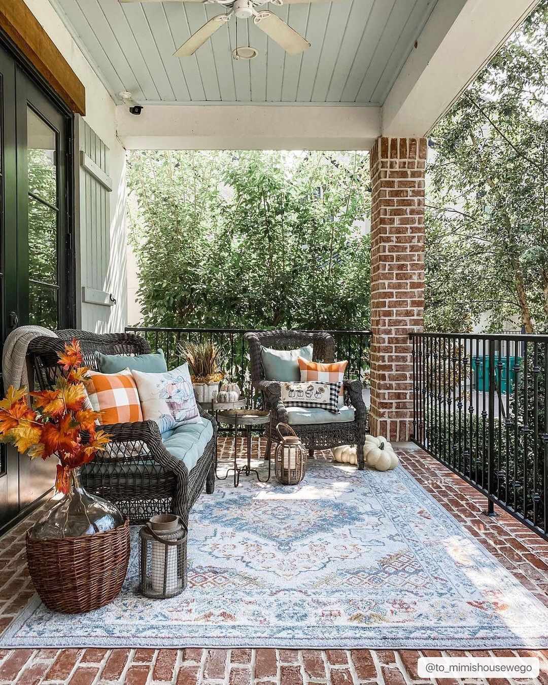Haymond area rug featuring a traditional multi-color medallion pattern in taupe, blue, and red. — view 3