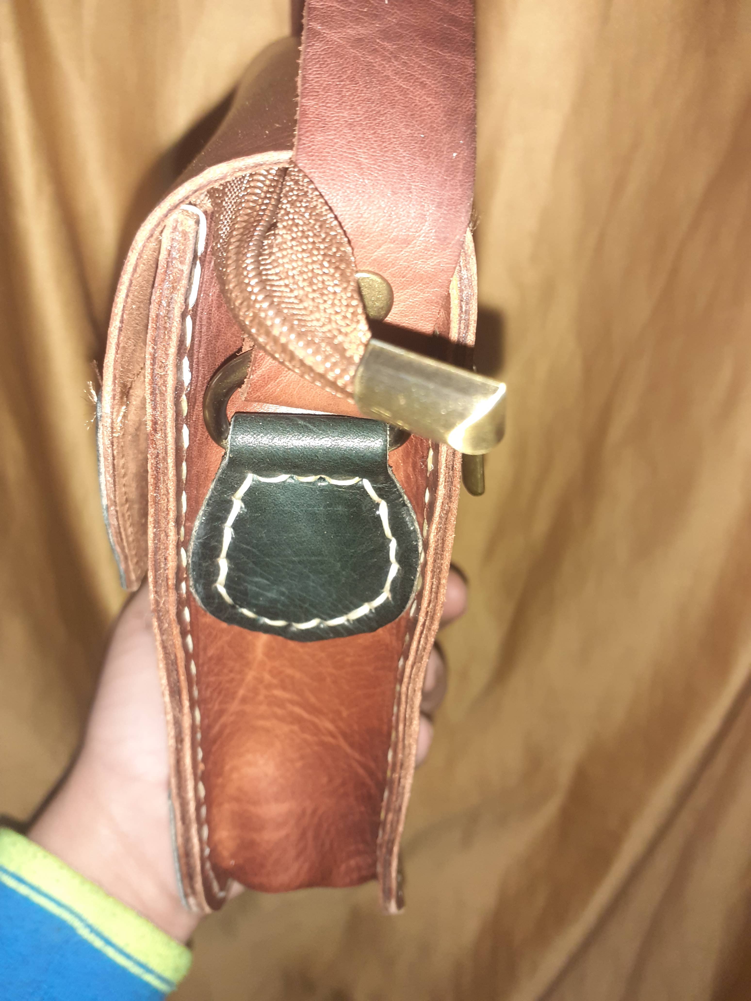 Two-tone leather crossbody bag with rustic finish, front zipper pocket, and long adjustable shoulder strap — view 14