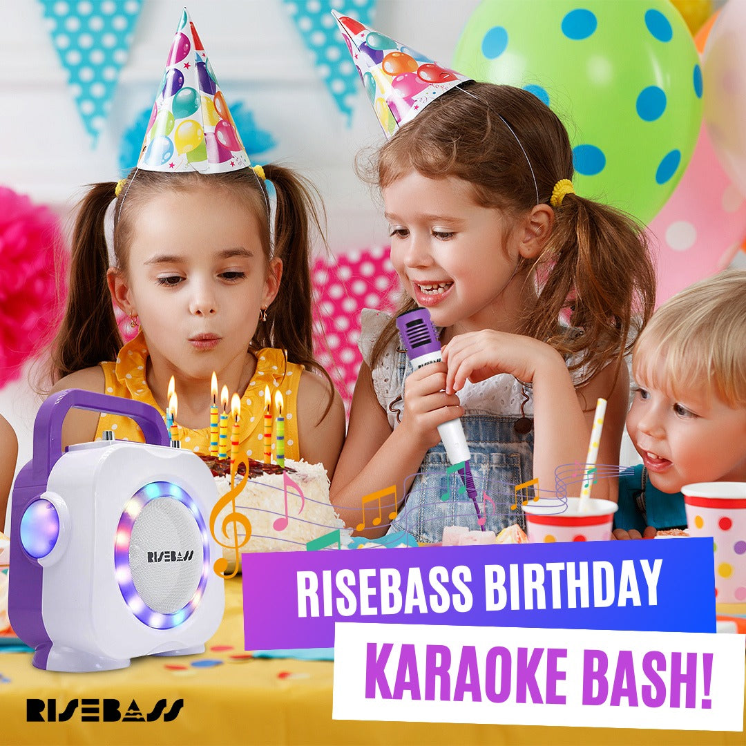 Purple kids Bluetooth karaoke machine with two wired microphones and colorful built in LED lighting effects — view 2