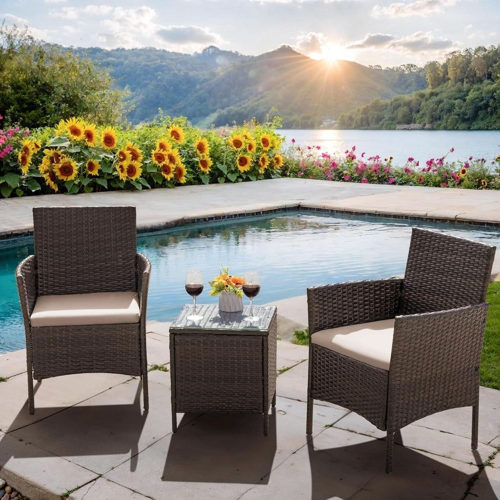 Three piece brown rattan outdoor patio set with two cushioned chairs and a tempered glass table — view 5