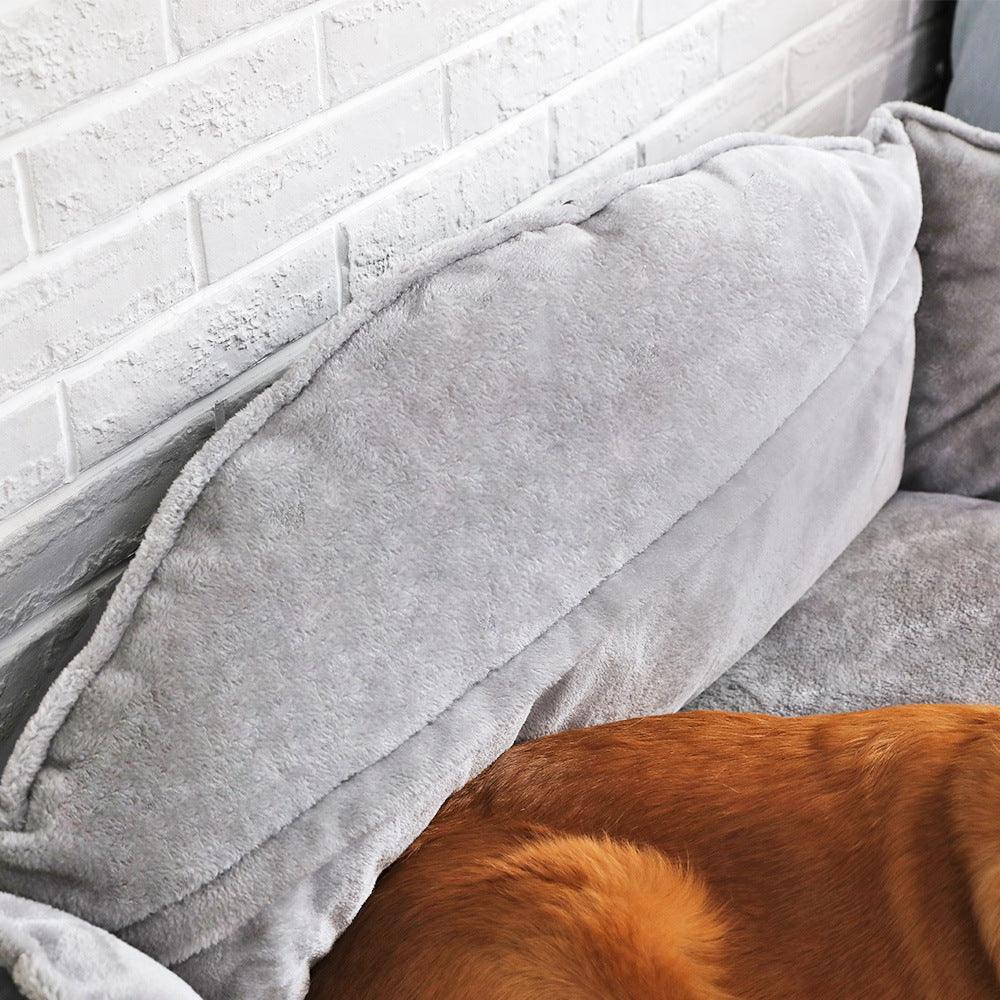 Plush polyester luxury sofa dog bed in a neutral color with cozy raised edges — view 2