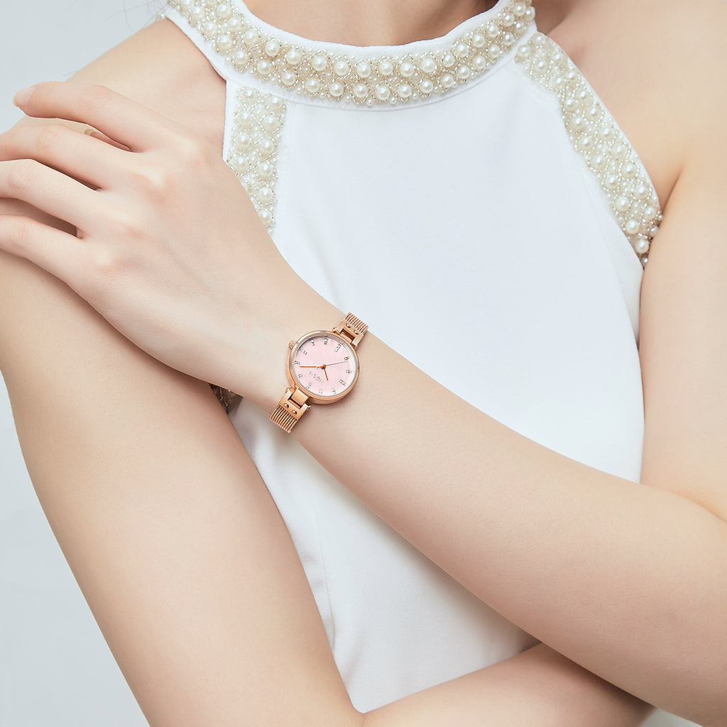 Women's quartz wristwatch featuring a round brass case and elegant metallic mesh steel band. — view 3