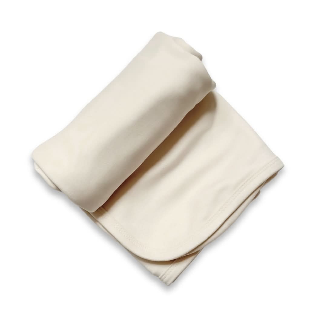 Cream baby bamboo swaddle blanket made of soft breathable fabric for comforting newborn sleep and nursing