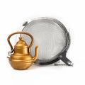 Stainless steel mesh tea infuser ball with a decorative gold teapot charm and metal chain