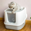 Enclosed anti-splash cat litter box in modern minimalist plastic design with high walls