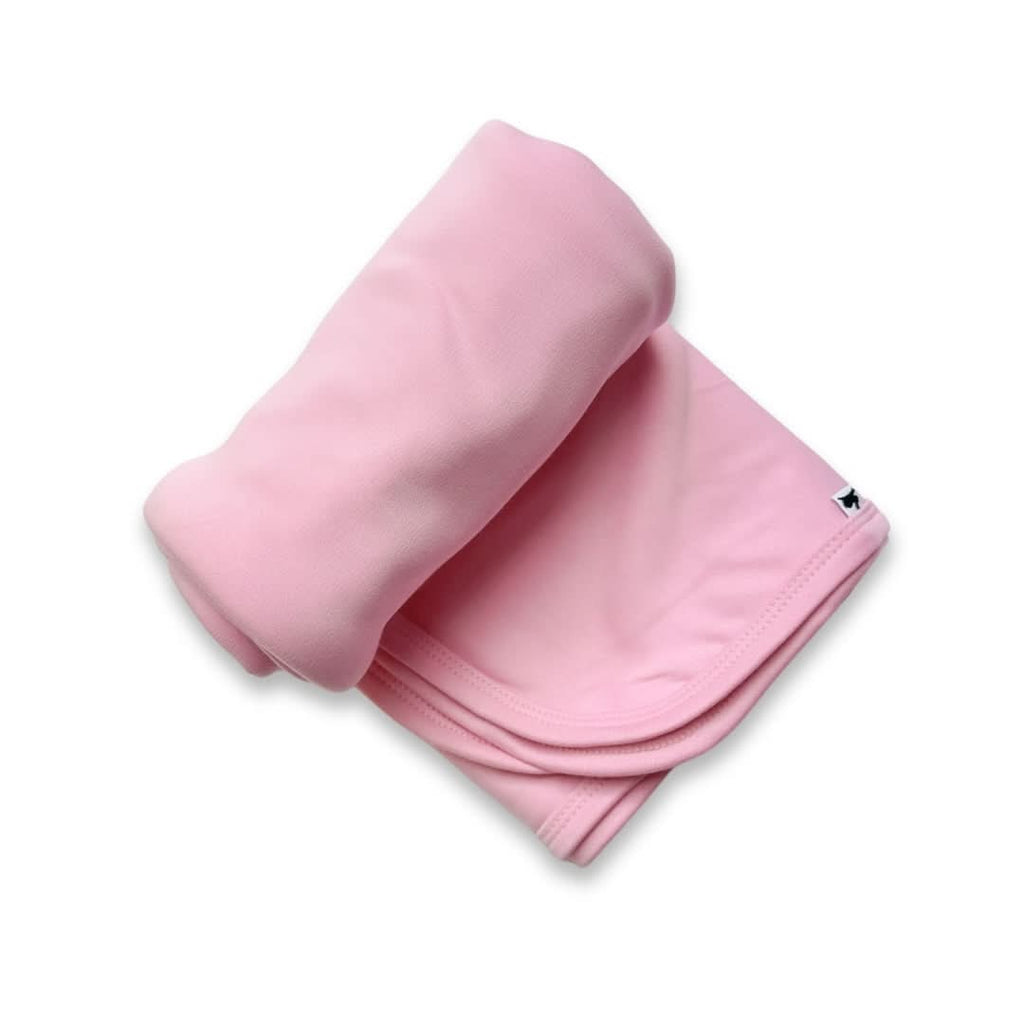 Taffy pink baby bamboo swaddle blanket folded flat showcasing soft knit fabric and generous sizing