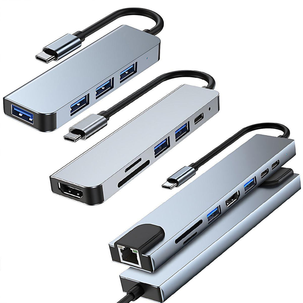 Space grey multi-port USB-C hub adapter for laptops featuring HDMI, USB, and memory card slots. — view 2