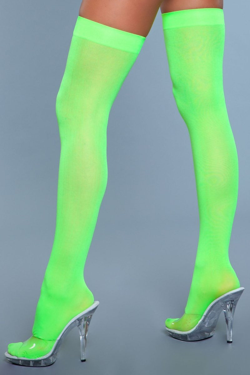 Opaque nylon thigh highs with solid band, showcasing seamless toe-to-thigh coverage for women's fashion — view 4