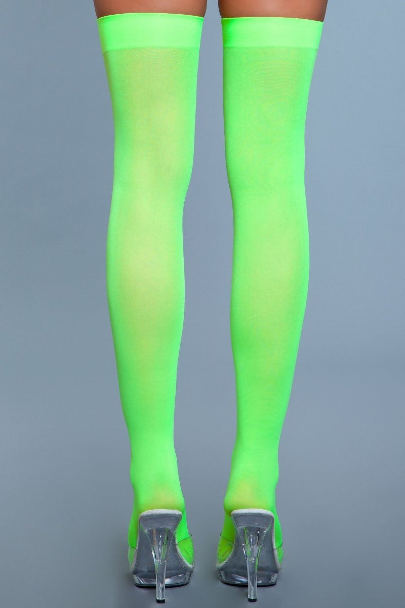 Opaque nylon thigh highs with solid band, showcasing seamless toe-to-thigh coverage for women's fashion — view 5