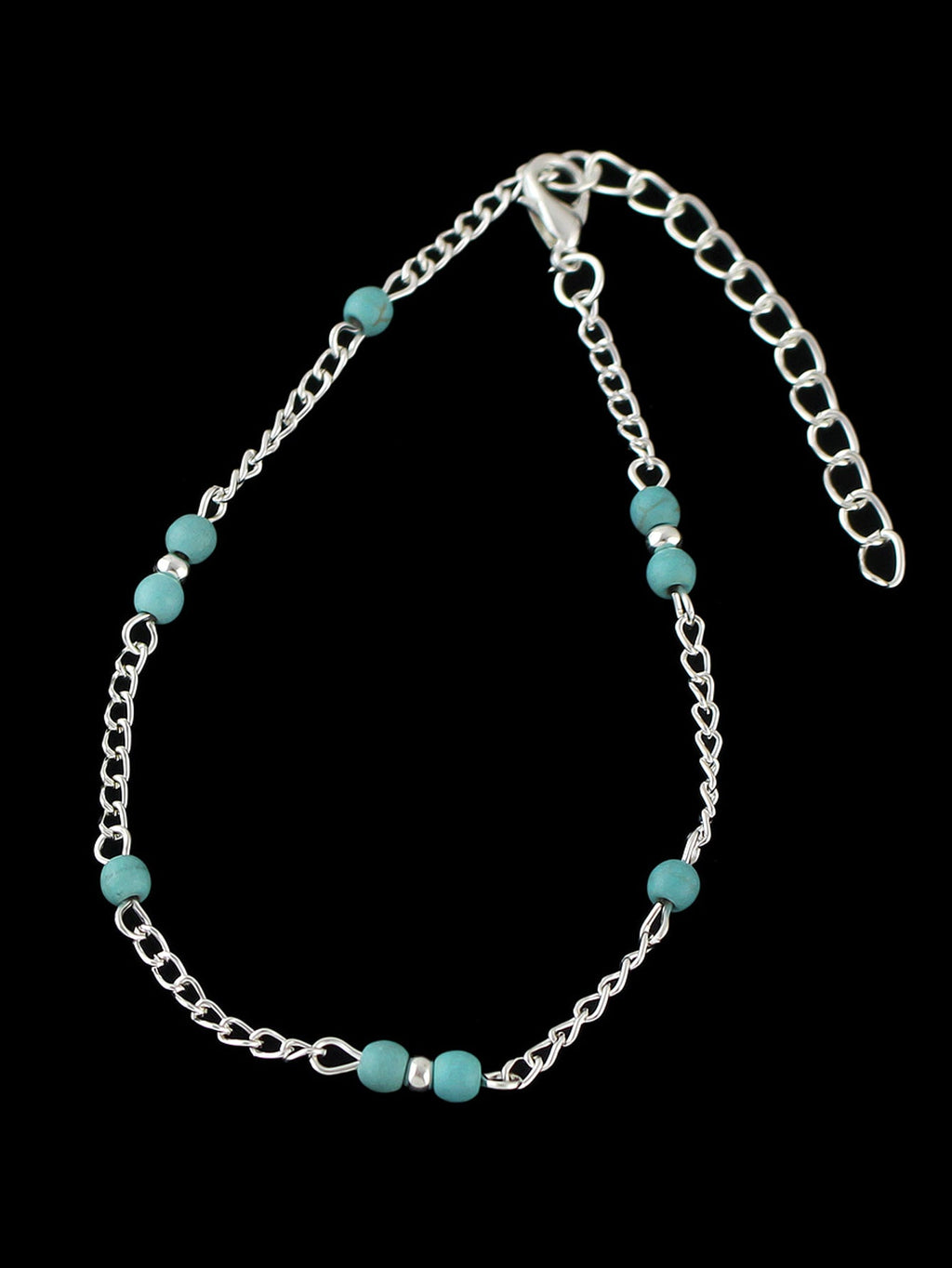 Boho chic turquoise barefoot sandal anklet with delicate silver chains draped gracefully over a foot — view 3