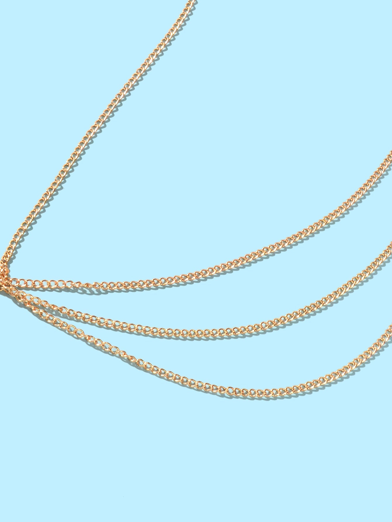 Layered gold and silver tassel body chain worn over a bikini for beach parties — view 3