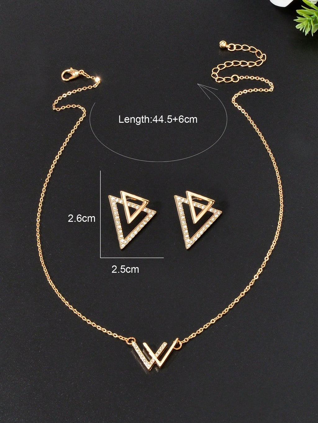 Double V pendant necklace and matching triangle earrings set featuring polished metallic geometric design. — view 4