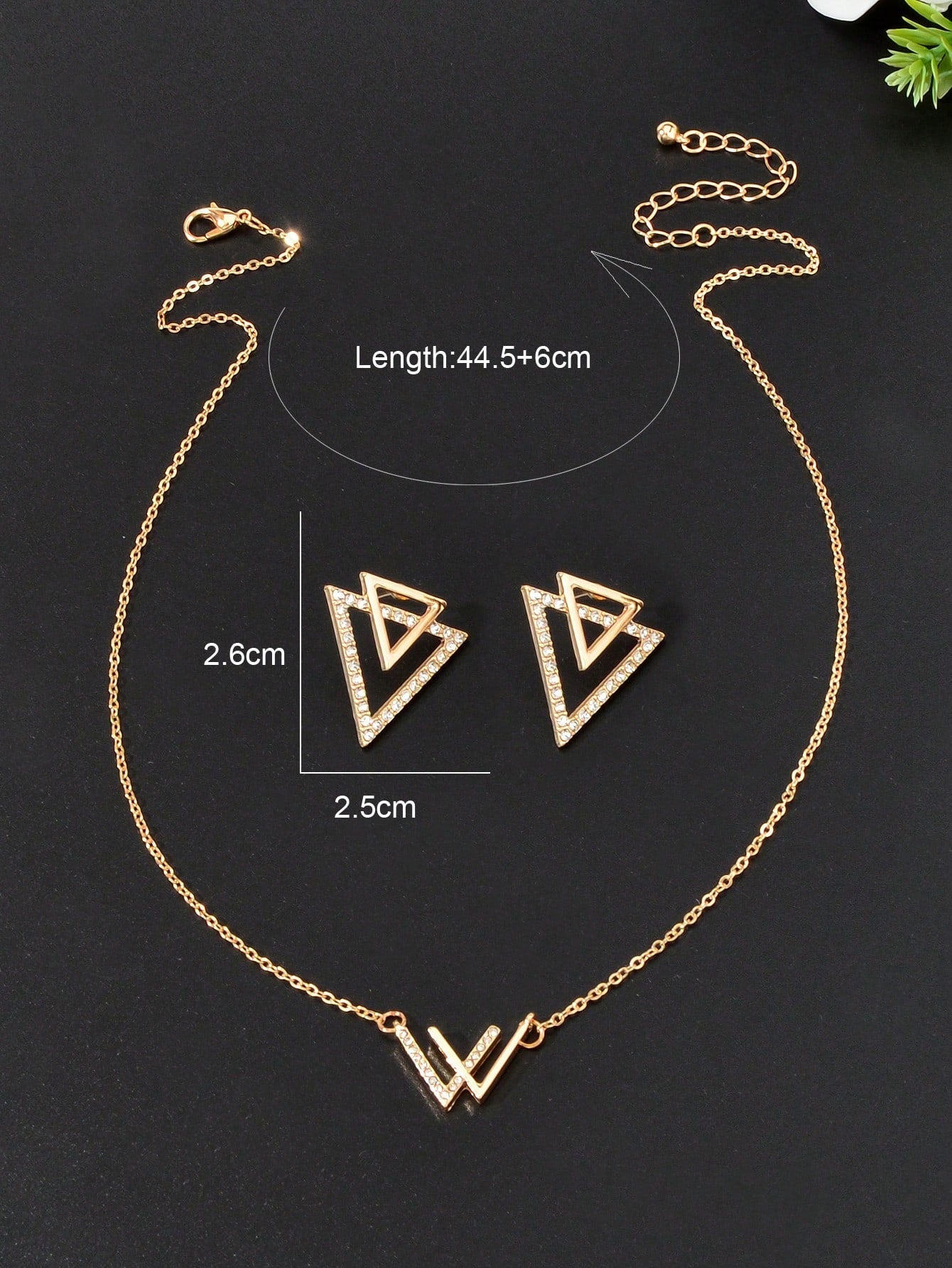Double V pendant necklace and matching triangle earrings set featuring polished metallic geometric design. — view 4