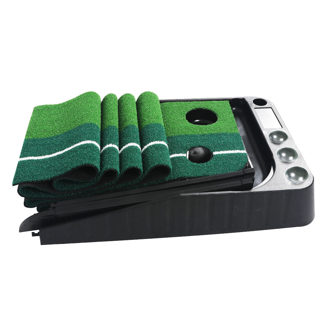 Green and black portable indoor golf putting mat with automatic ball return track and dual holes — view 3