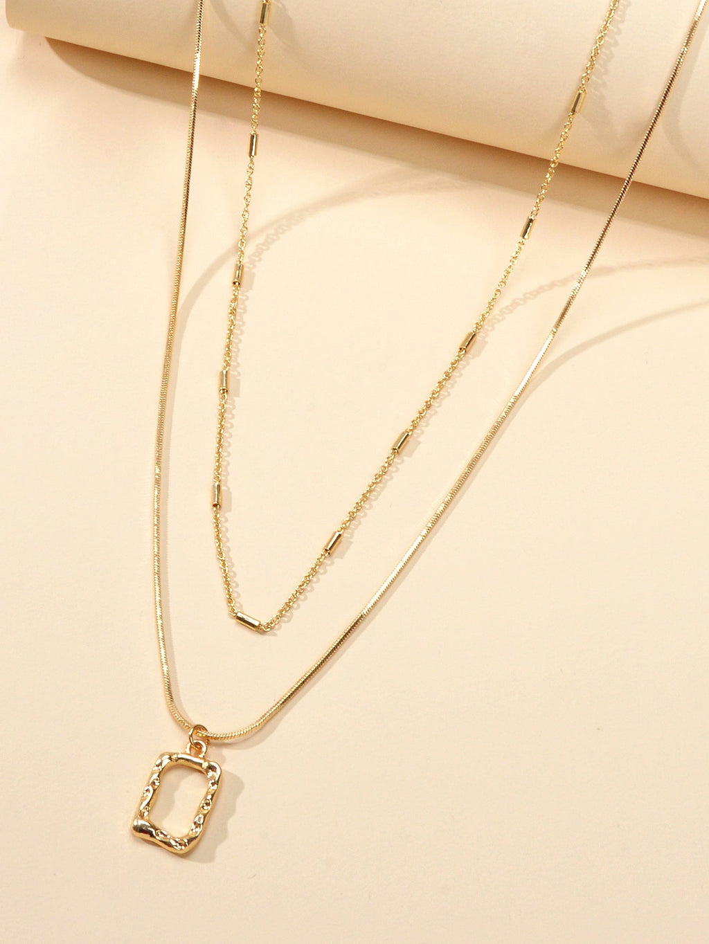 Minimalist square pendant layered necklace set with adjustable chain in metallic gold and silver finish — view 3