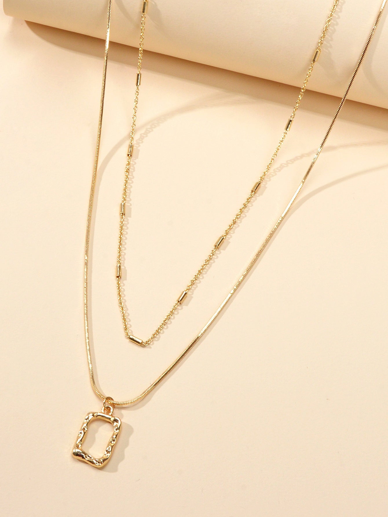 Minimalist square pendant layered necklace set with adjustable chain in metallic gold and silver finish — view 3