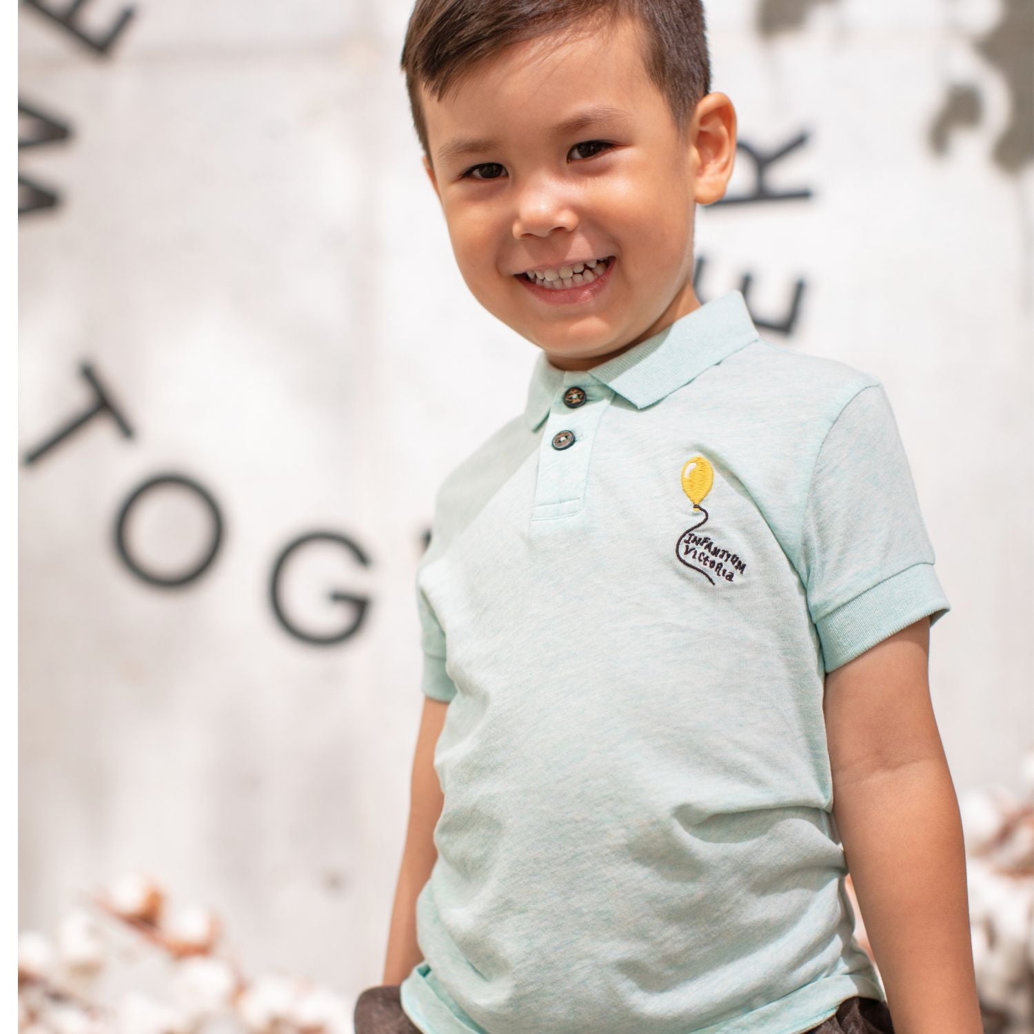 Mint green organic cotton kids polo shirt with coconut buttons and pocket balloon embroidery — view 3