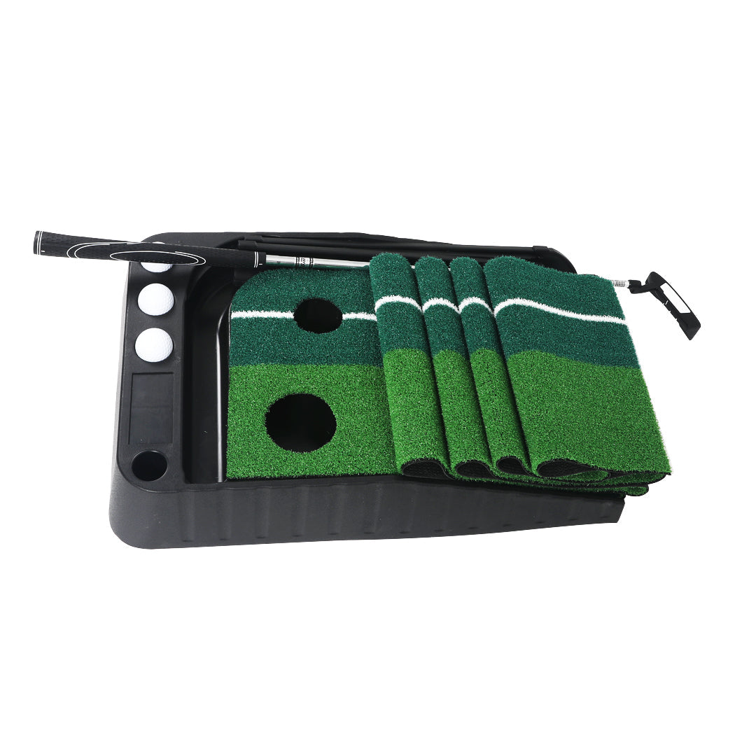 Portable green golf putting mat with ball return track, steel putter, and three white golf balls. — view 3