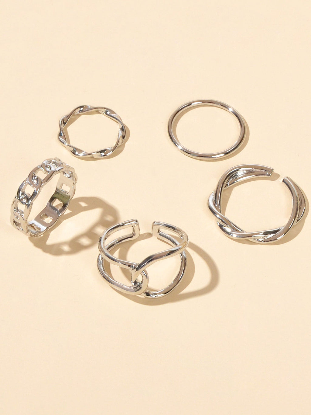 Set of five minimalist stackable midi finger rings in trendy gold and silver finishes — view 3