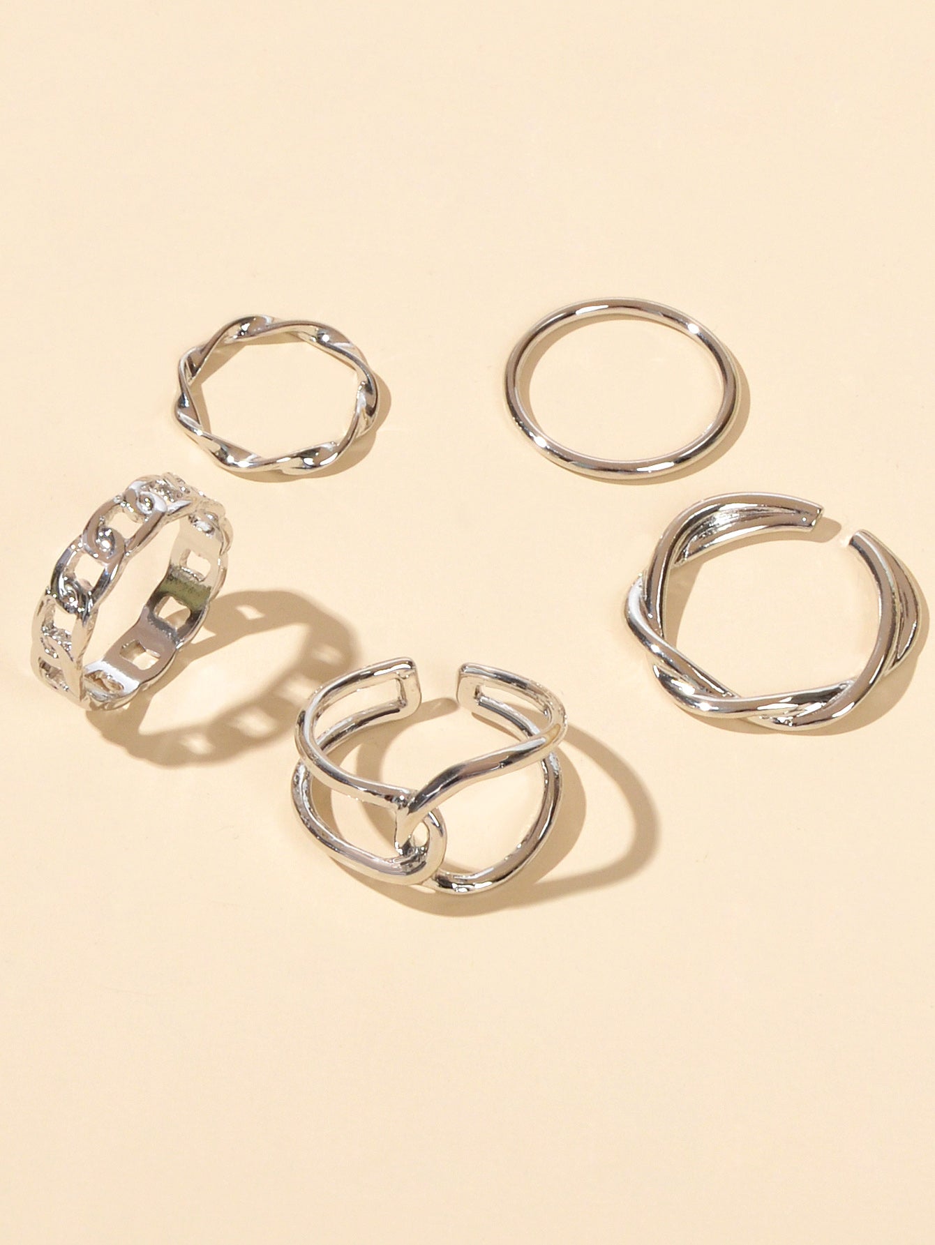 Set of five minimalist stackable midi finger rings in trendy gold and silver finishes — view 3