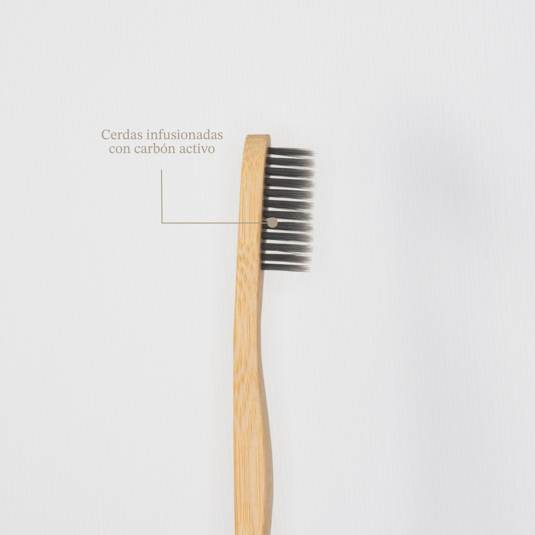 Eco-friendly bamboo toothbrush with soft whitening bristles and a natural wooden handle — view 5