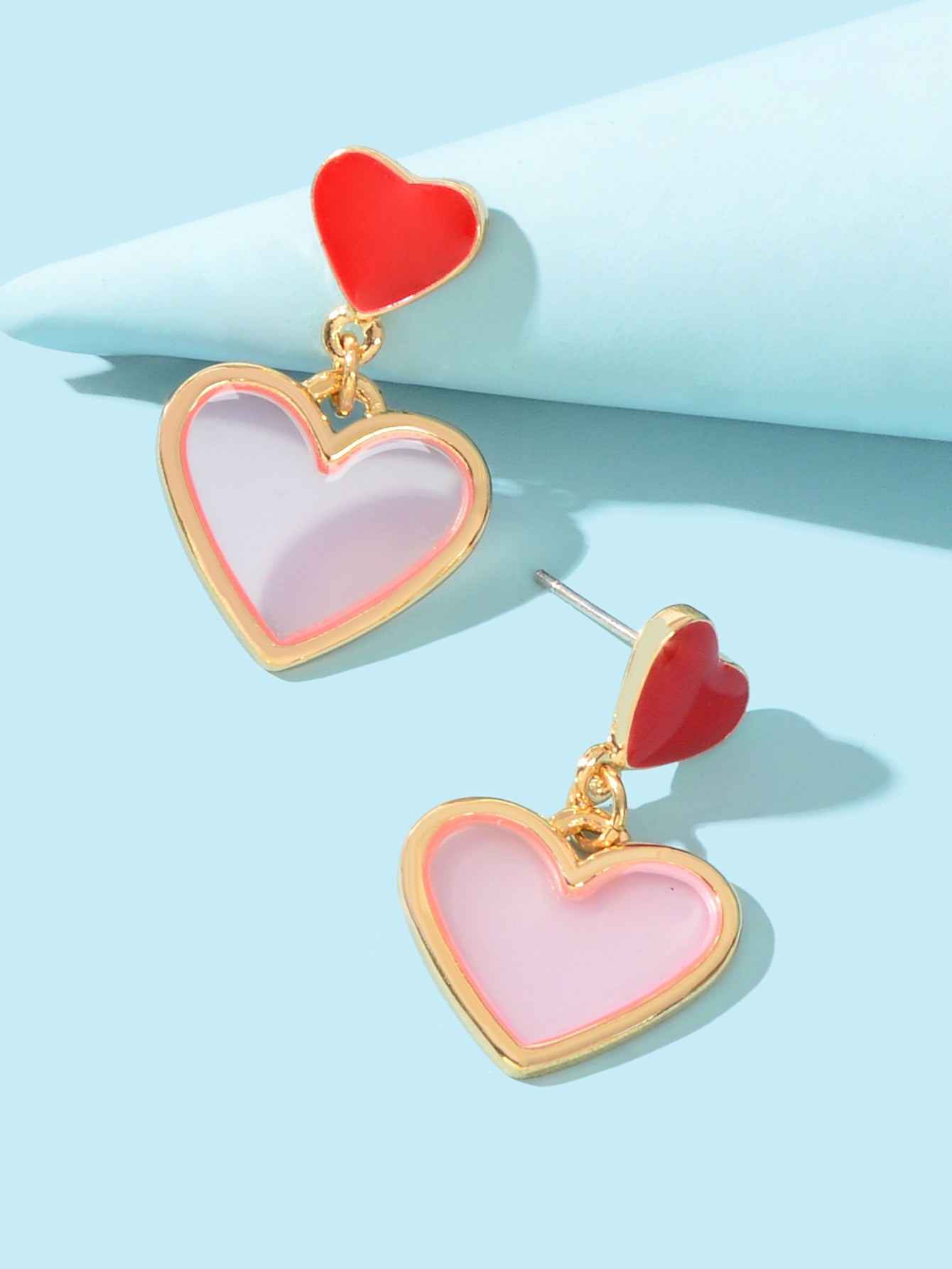 Elegant dangling love heart drop stud earrings for women on a clean background — view 3