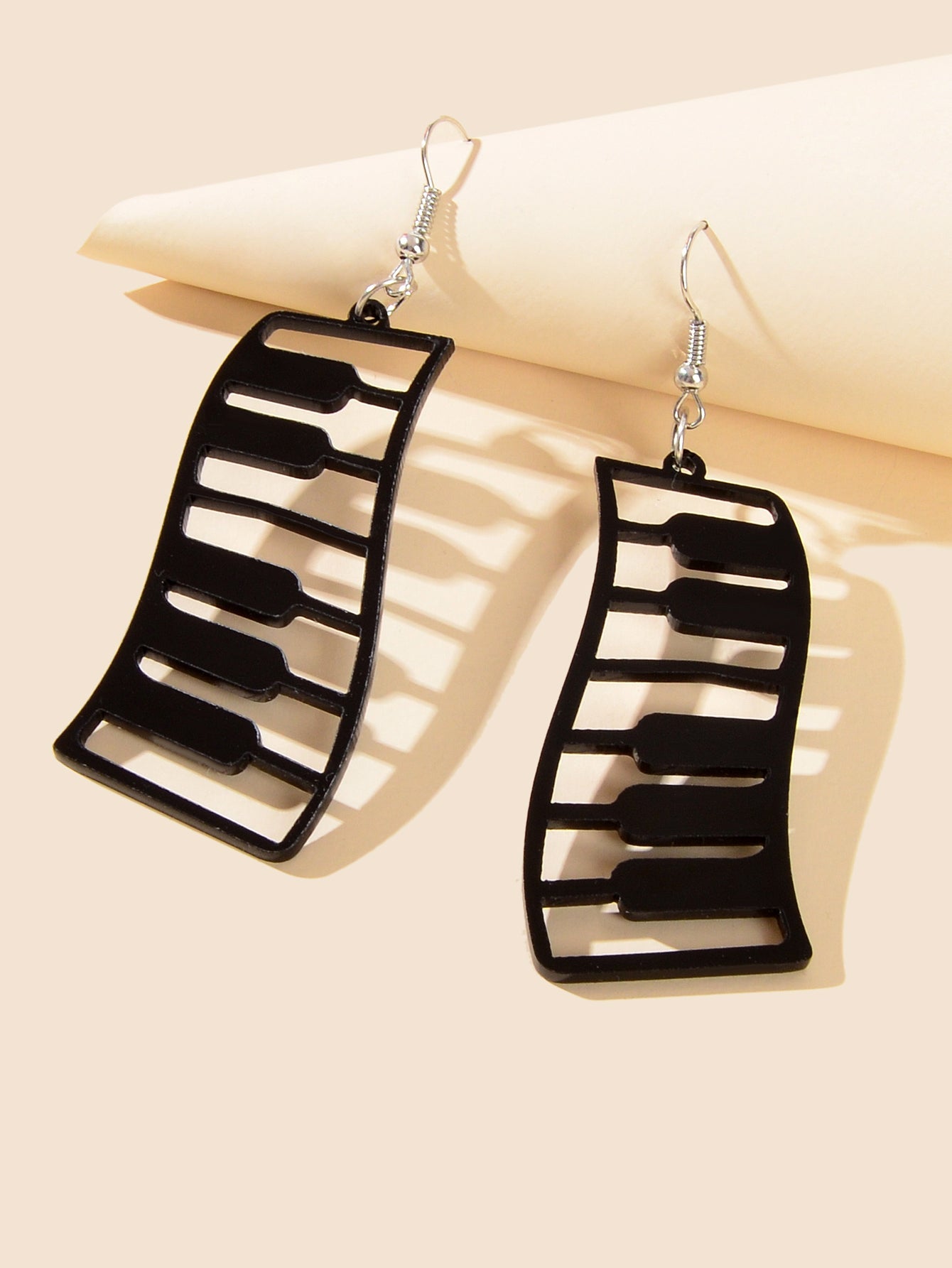 Black and white resin piano keyboard drop statement earrings with dangle design — view 3