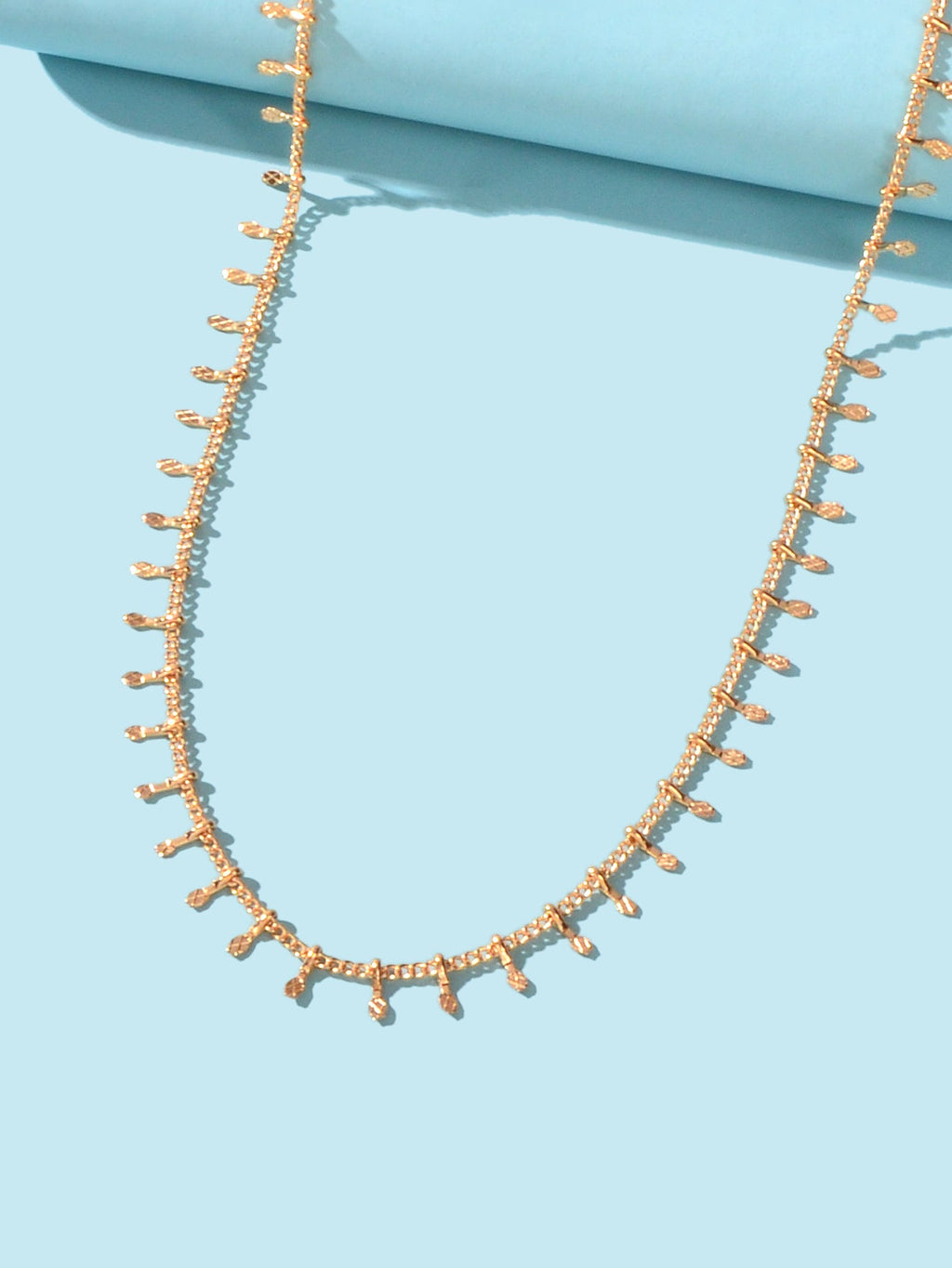 Dainty gold charm choker necklace on a delicate short chain for minimalist everyday fashion. — view 3