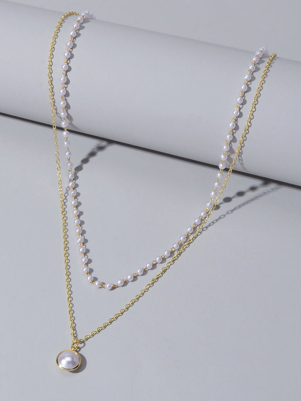 Retro gold double layer chain necklace featuring a classic lustrous pearl pendant for women — view 3