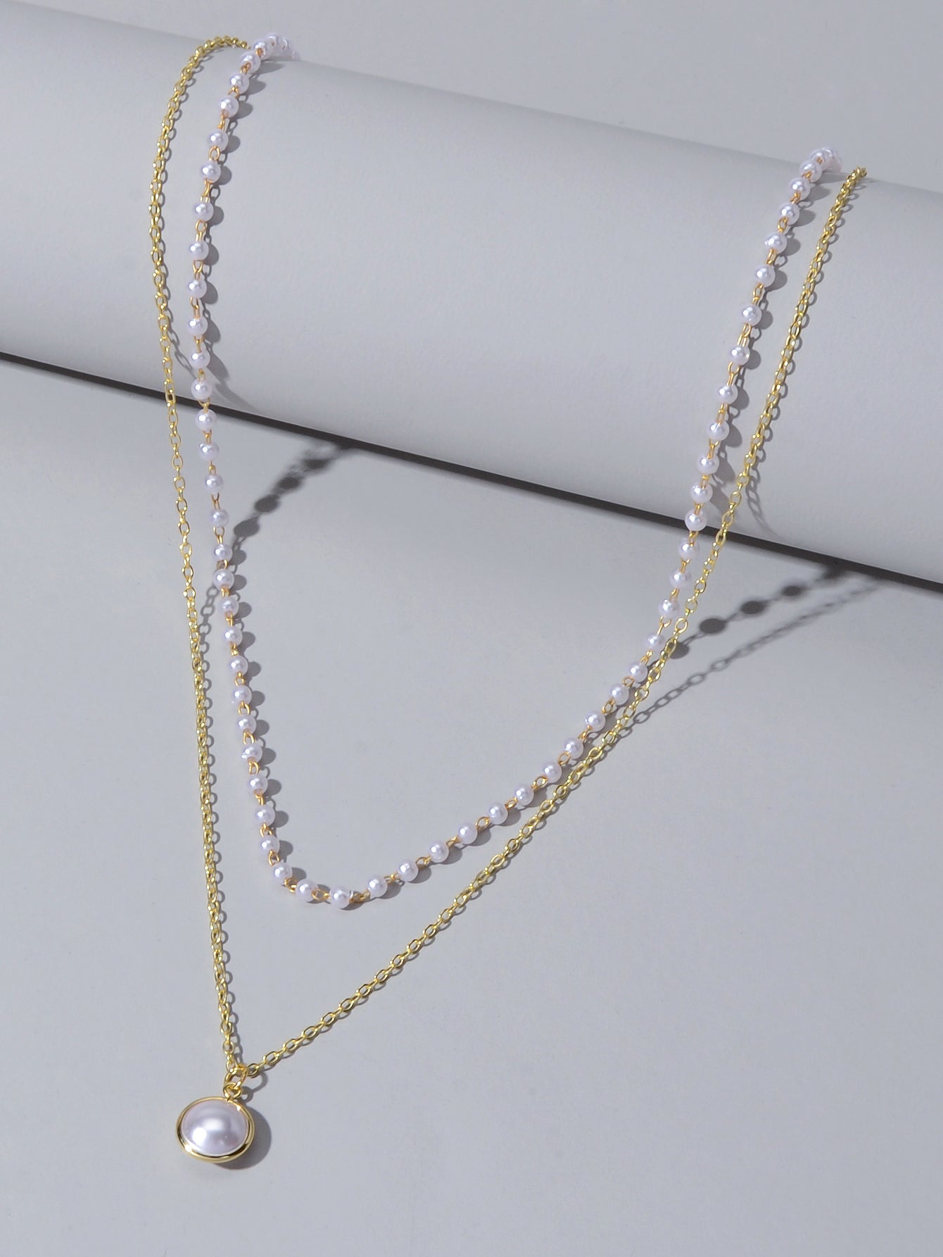 Retro gold double layer chain necklace featuring a classic lustrous pearl pendant for women — view 3