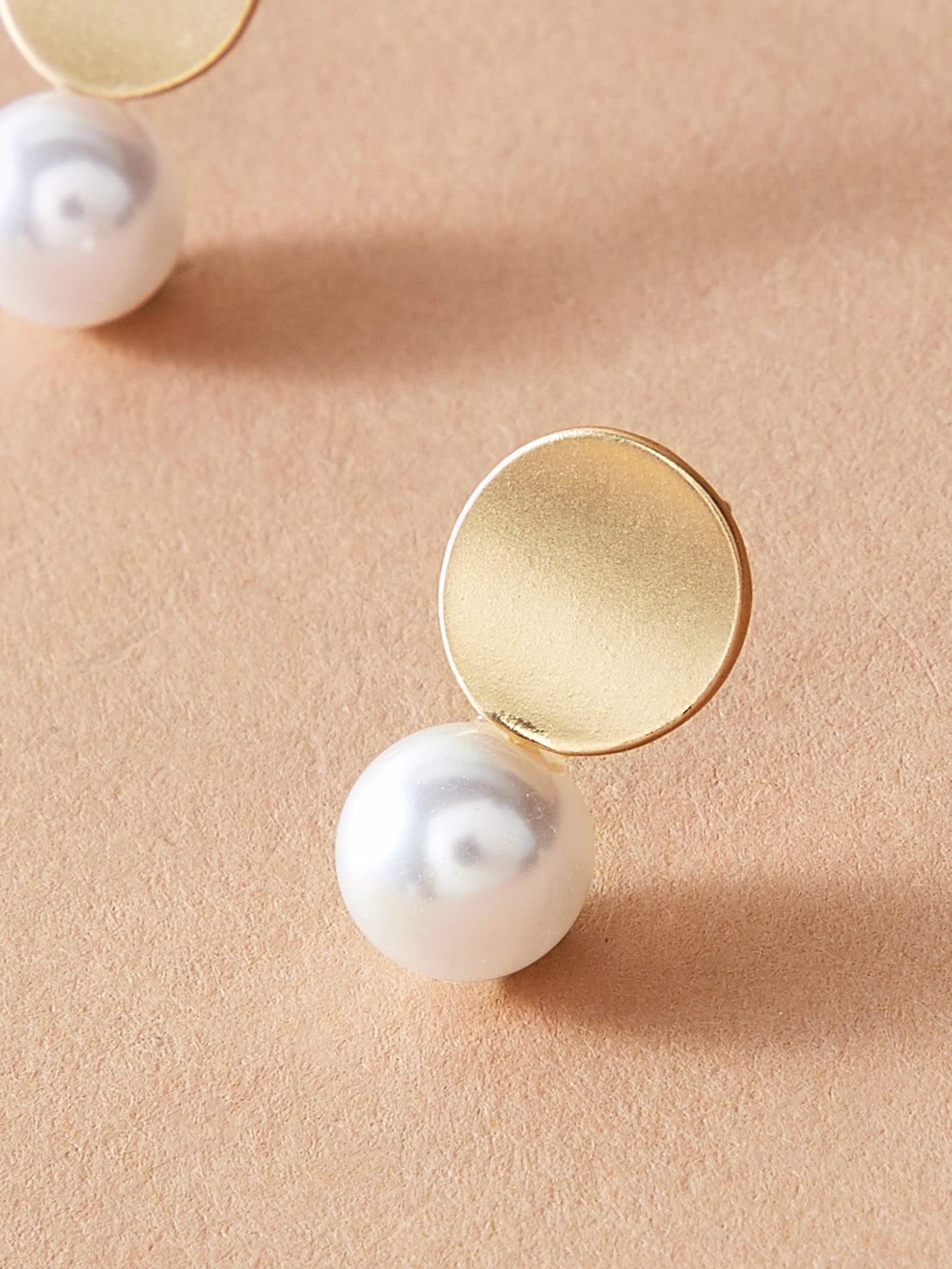 Dainty round gold metal faux pearl stud earrings for daily wear and elegant occasions. — view 3