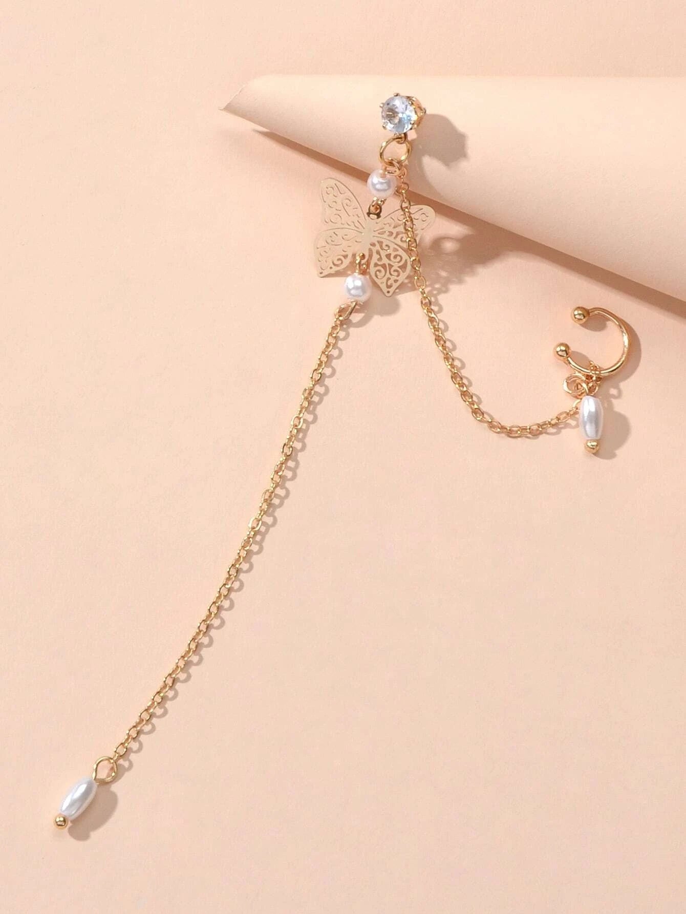 Crystal and pearl butterfly ear cuff with a long dangling chain and cartilage stud — view 3