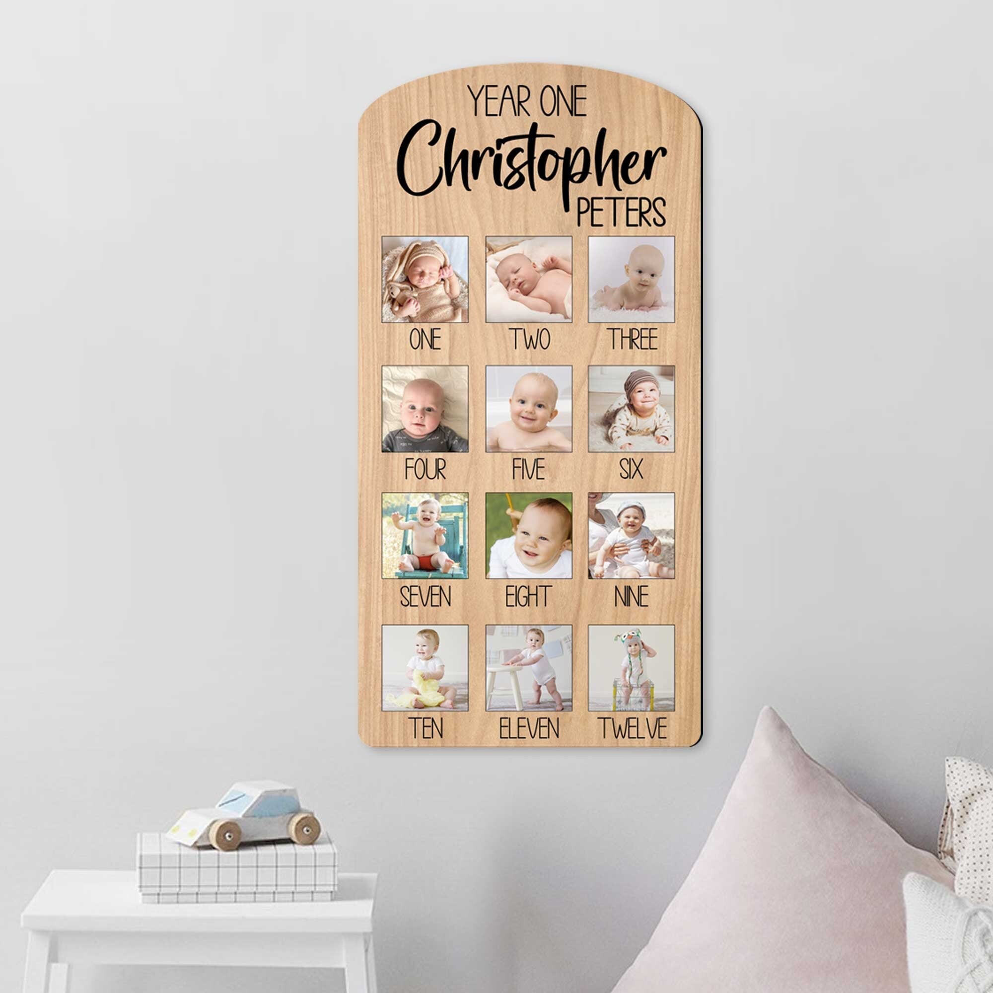 Custom wooden baby milestone photo board displaying twelve months of pictures with personalized cut out name — view 4