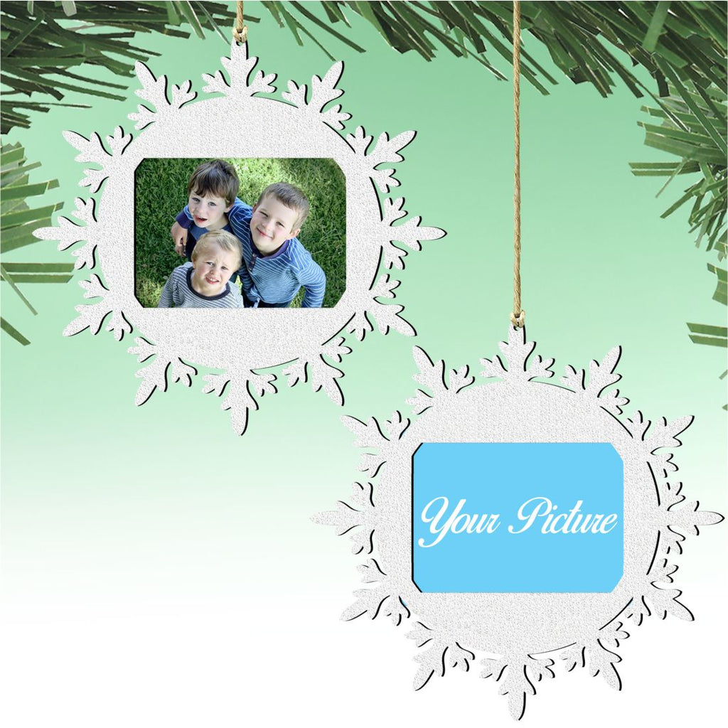 Wooden snowflake Christmas photo ornament featuring a central picture frame for festive tree decorations