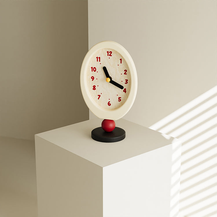 Minimalist retro desktop clock in oval wood with a playful red sphere base — view 2
