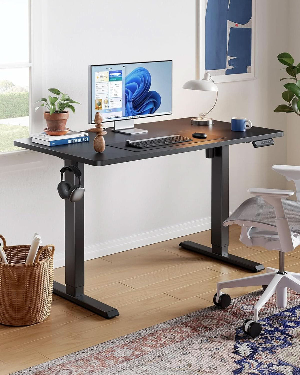 Black 48 inch electric standing desk with steel frame, programmable keypad, and dual storage hooks — view 2