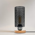 Retro industrial table lamp with metal wire cage and natural wooden base for bedroom lighting