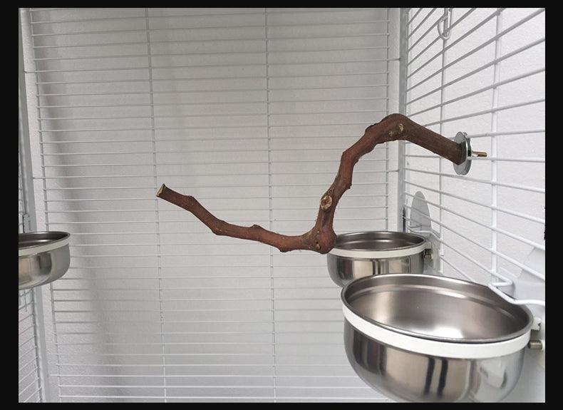 Natural vine parrot perch made of authentic grape wood installed inside a wire bird cage — view 5