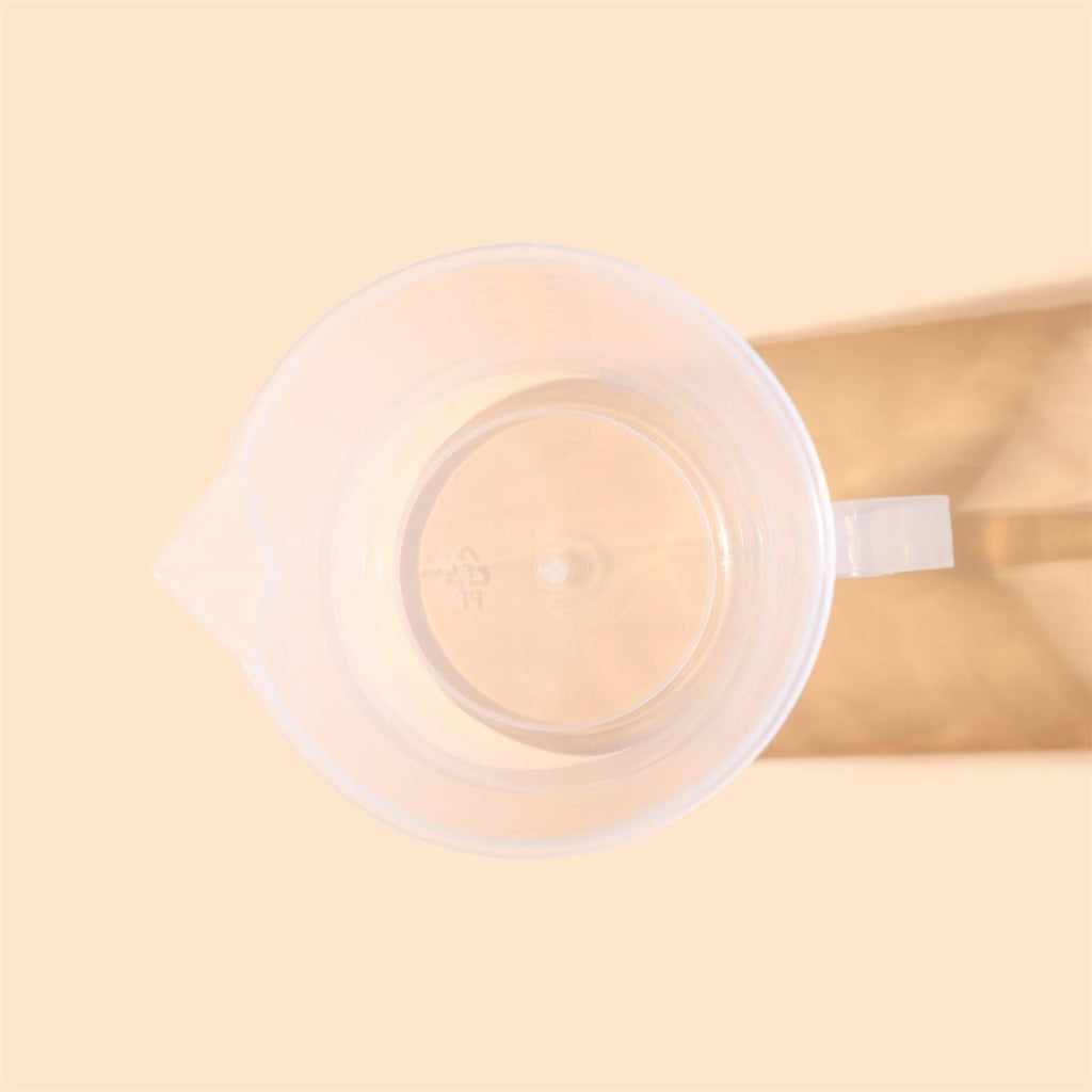 Clear 1000ml measuring cup with precise graduation marks and convenient pour spout for kitchen use — view 5