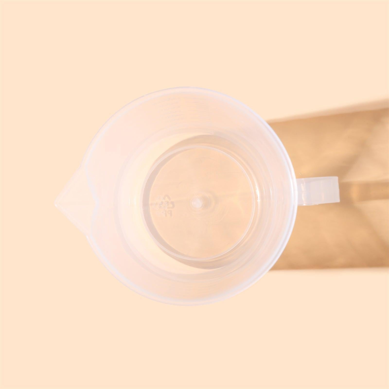 Clear 1000ml measuring cup with precise graduation marks and convenient pour spout for kitchen use — view 5