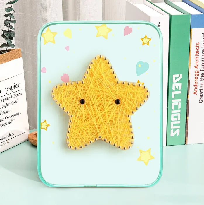 DIY star string art craft kit with colorful string, pins, wooden base, and display stand