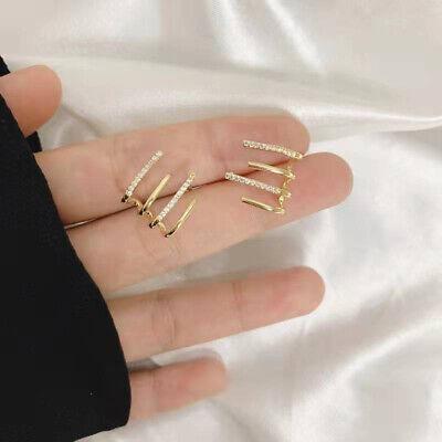 Spiral hoop earrings with a polished gold finish, lightweight and hypoallergenic design — view 4