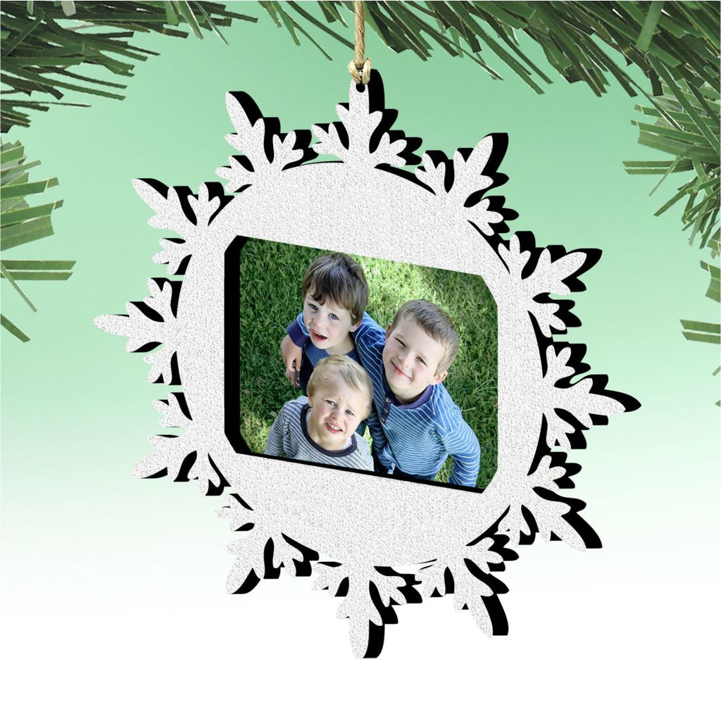 Wooden snowflake Christmas photo ornament featuring a central picture frame for festive tree decorations — view 2