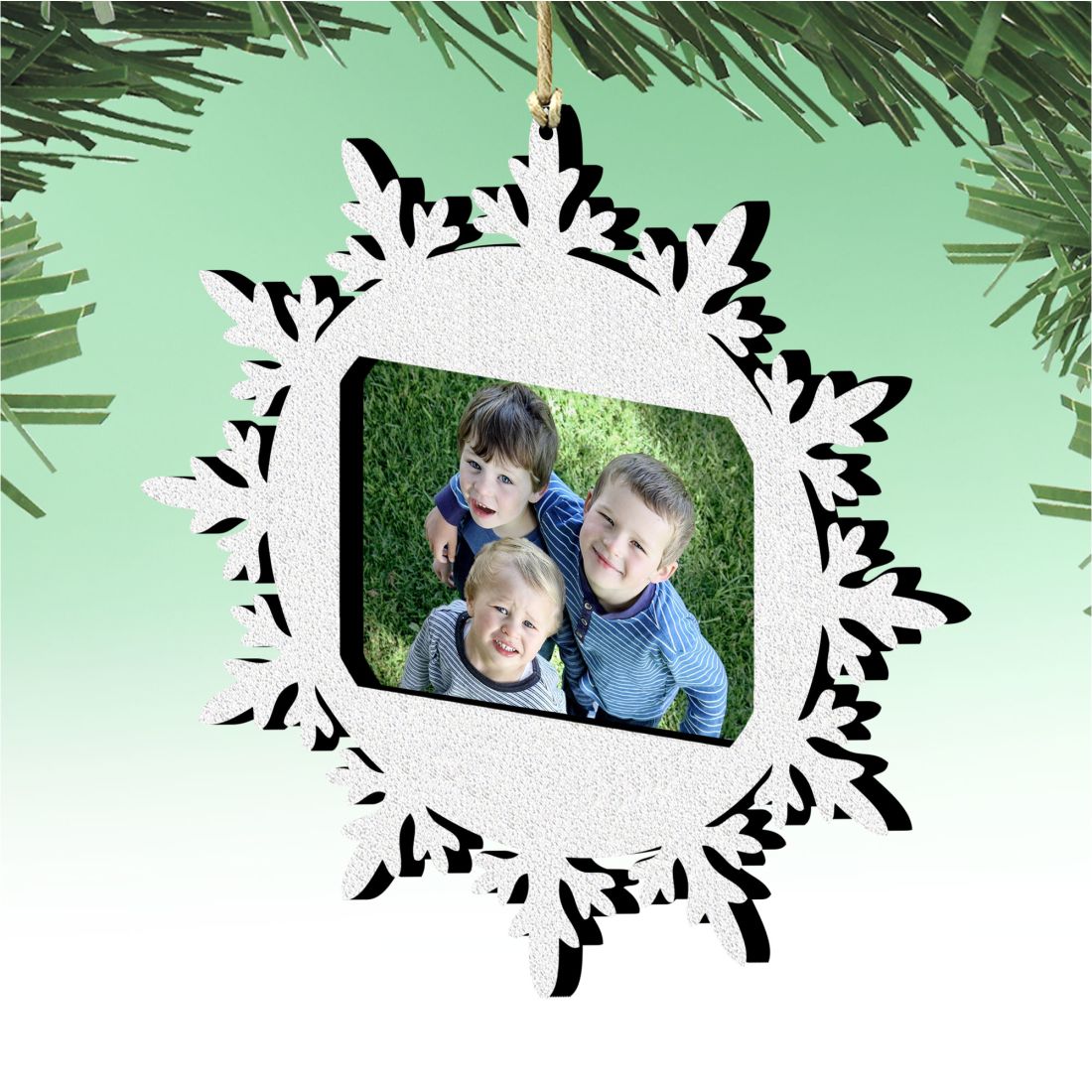 Wooden snowflake Christmas photo ornament featuring a central picture frame for festive tree decorations — view 2