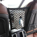 Black polyester universal car seat storage net and pet barrier suspended between two front seats